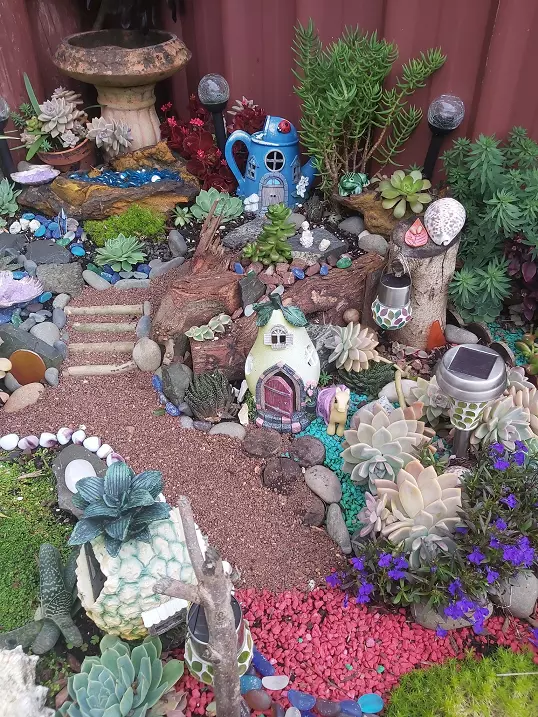 large fairy garden decorated with succulents
