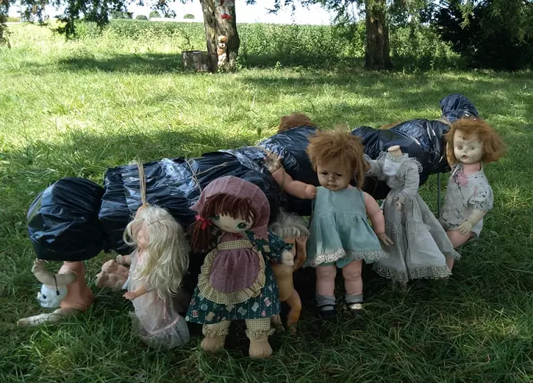 dolls carrying a dead body