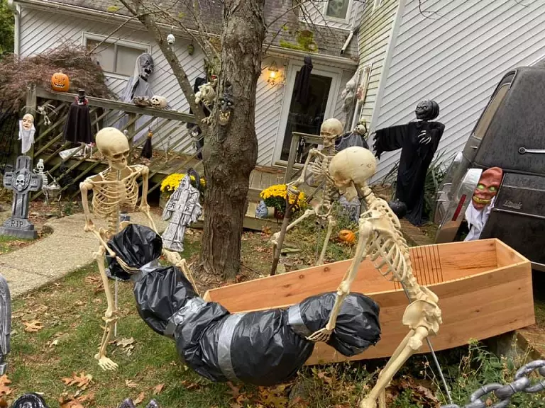 skeletons holding dead body
