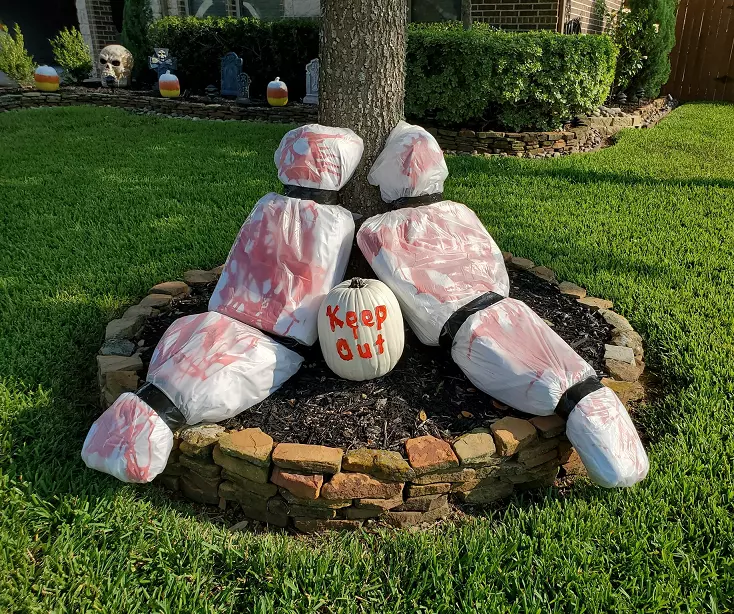 fake dead body Halloween lawn decoration