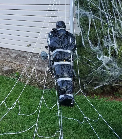 fake dead body spiderweb
