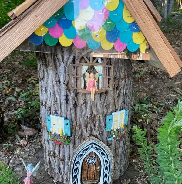 tree stump fairy house ideas 11