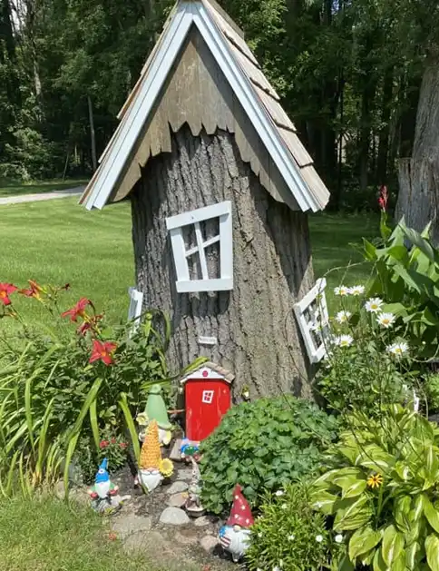tree stump fairy house ideas 25