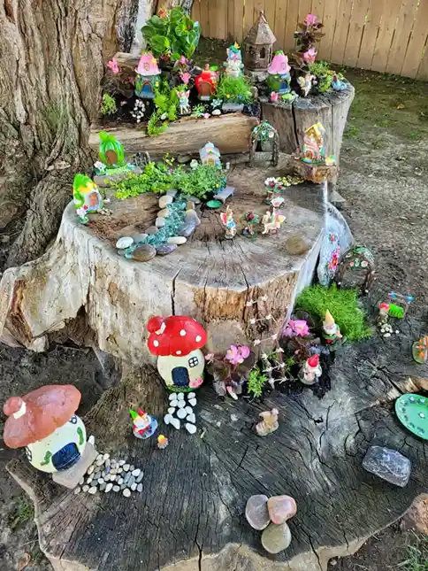 tree stump fairy house ideas 28