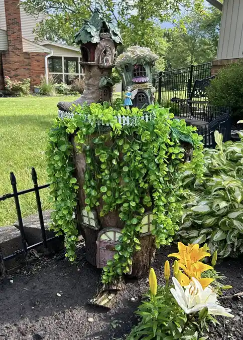 tree stump fairy house ideas 32