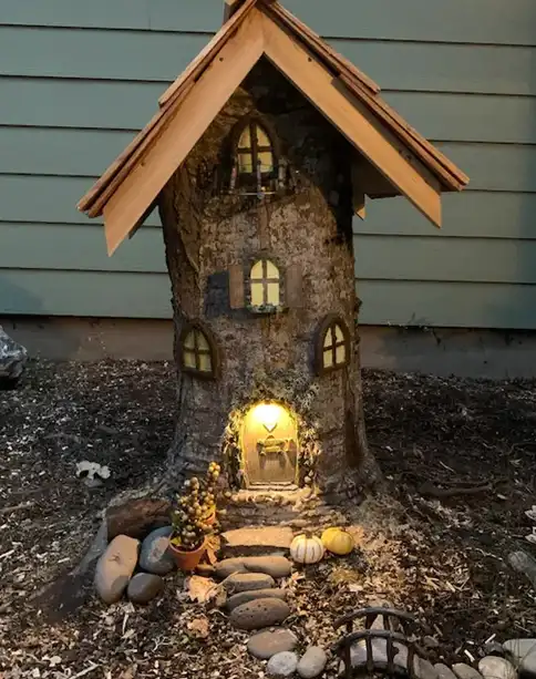 tree stump fairy house ideas 34