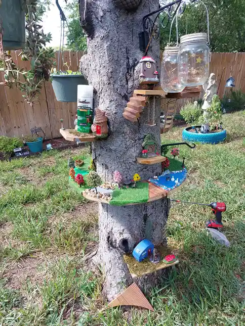 tree stump fairy house ideas 36