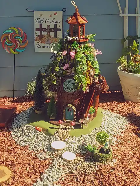 tree stump fairy house ideas 37