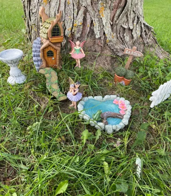 tree stump fairy house pond